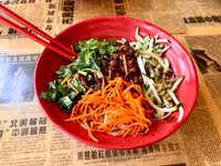 Za Jiang Mian: Classic Northern Chinese noodle dish. Ma Ma makes it with fresh organic egg noodle topped with savory ground pork sauce and julienne vegetables.